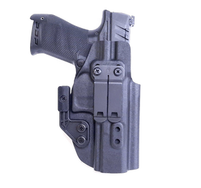 A black handgun holster with a firearm inside