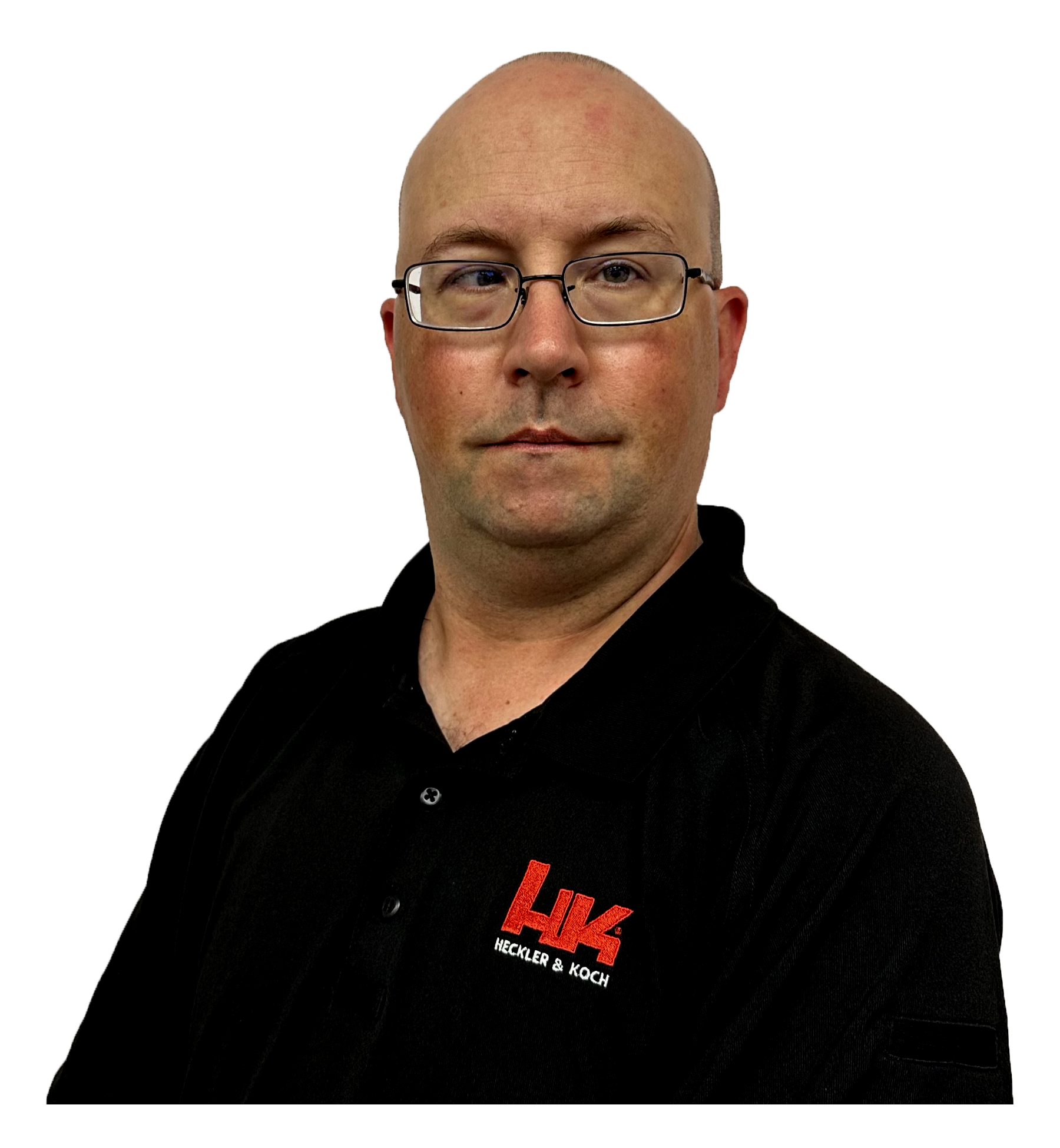 A bald man wearing glasses and a black hoodie with red and white text, standing in front of a background with lines of code or digital text.