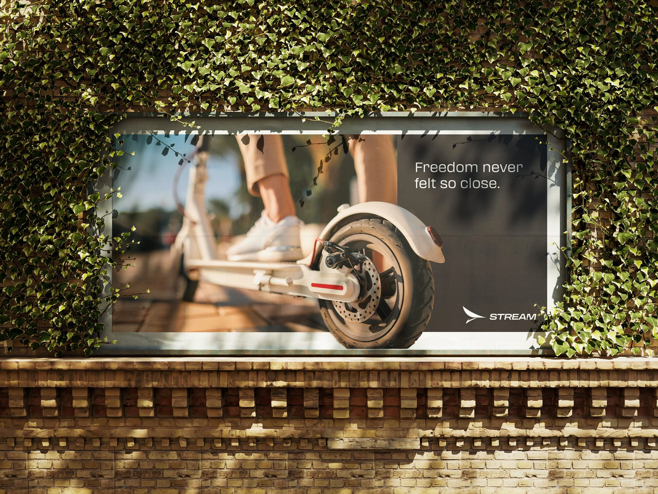 Part of an outdoor scene is visible, including green ivy covering a wall and a billboard with a partial image of a person riding a scooter, along with a quote stating, 'Freedom never felt so close.'