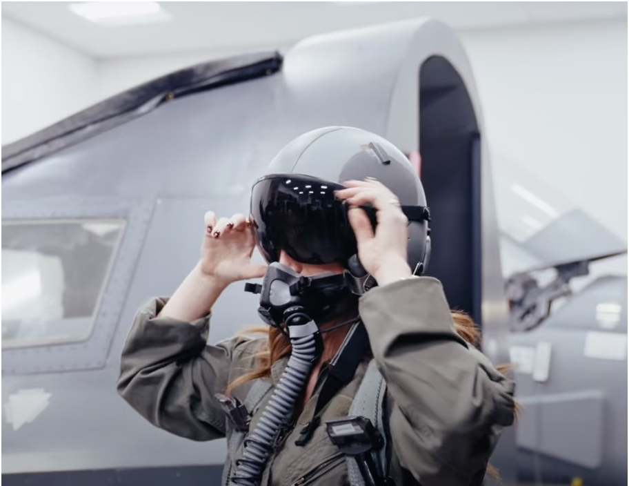 Mary Margaret Olohan tries on a helmet at Whiteman Airforce Base. 