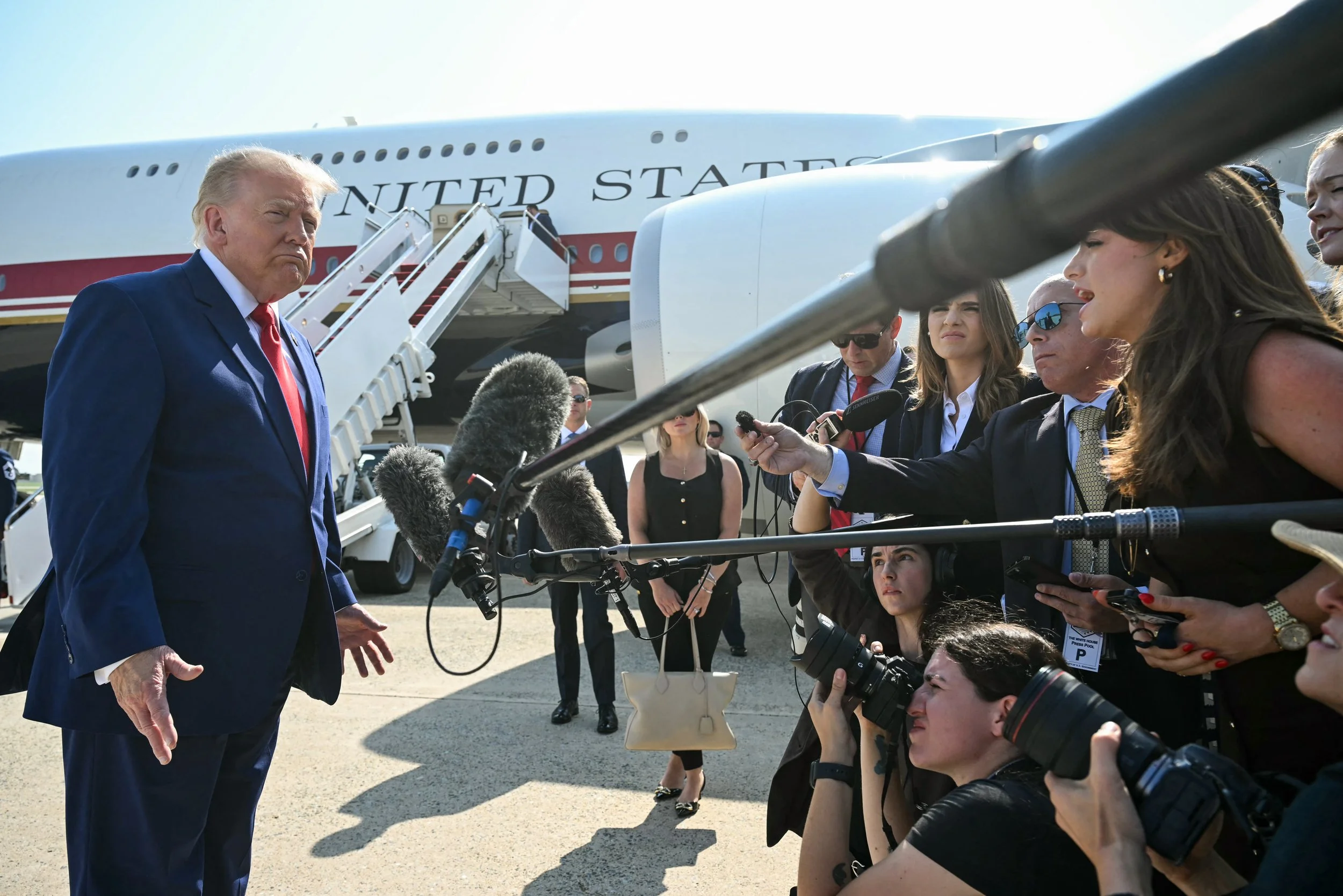 Former President Donald Trump takes a question from Mary Margaret Olohan in front of Air Force One at JBA.