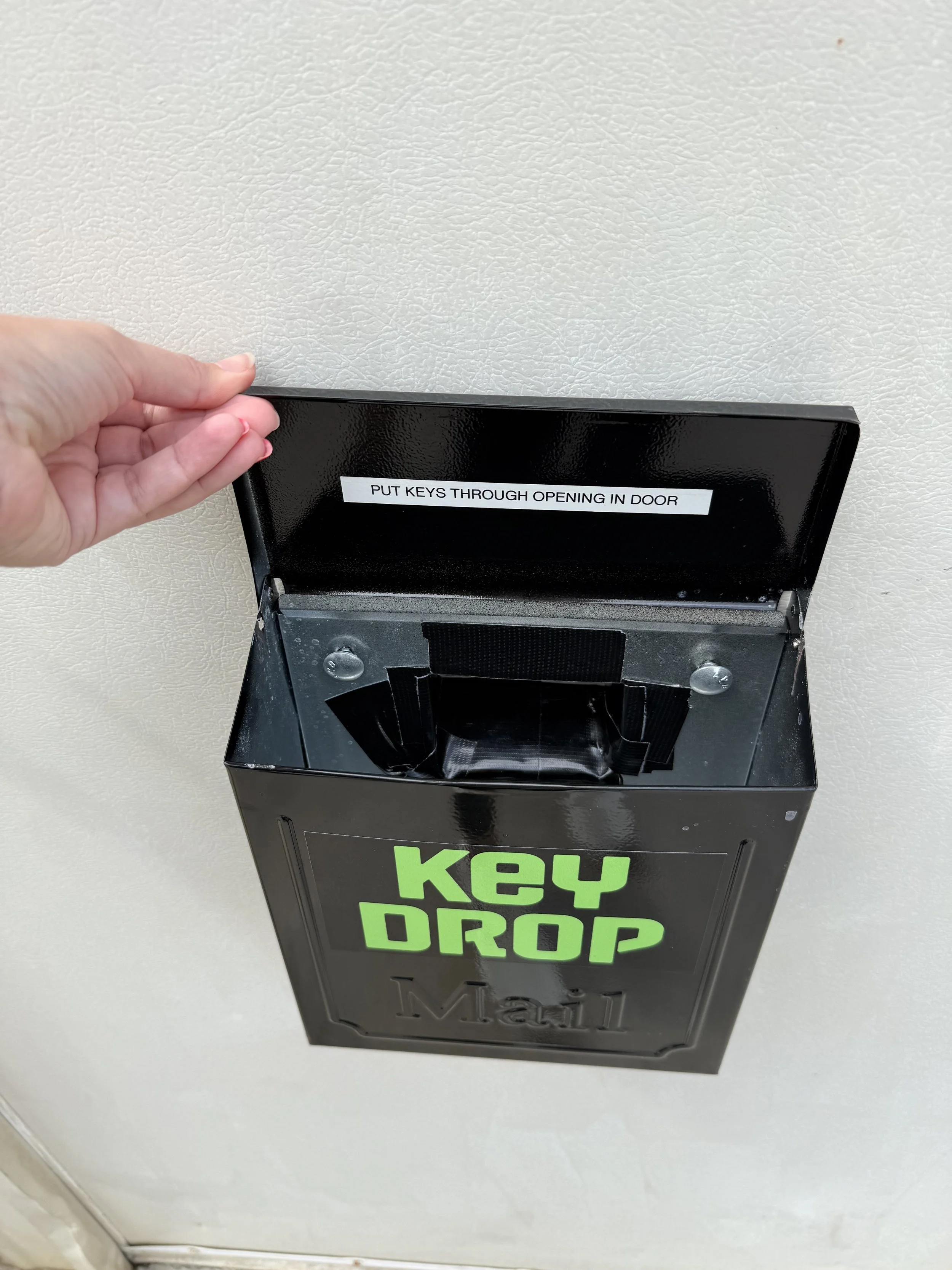 Key-Drop Box. - Lift the lid and push your keys through the small hole at the back of the box.