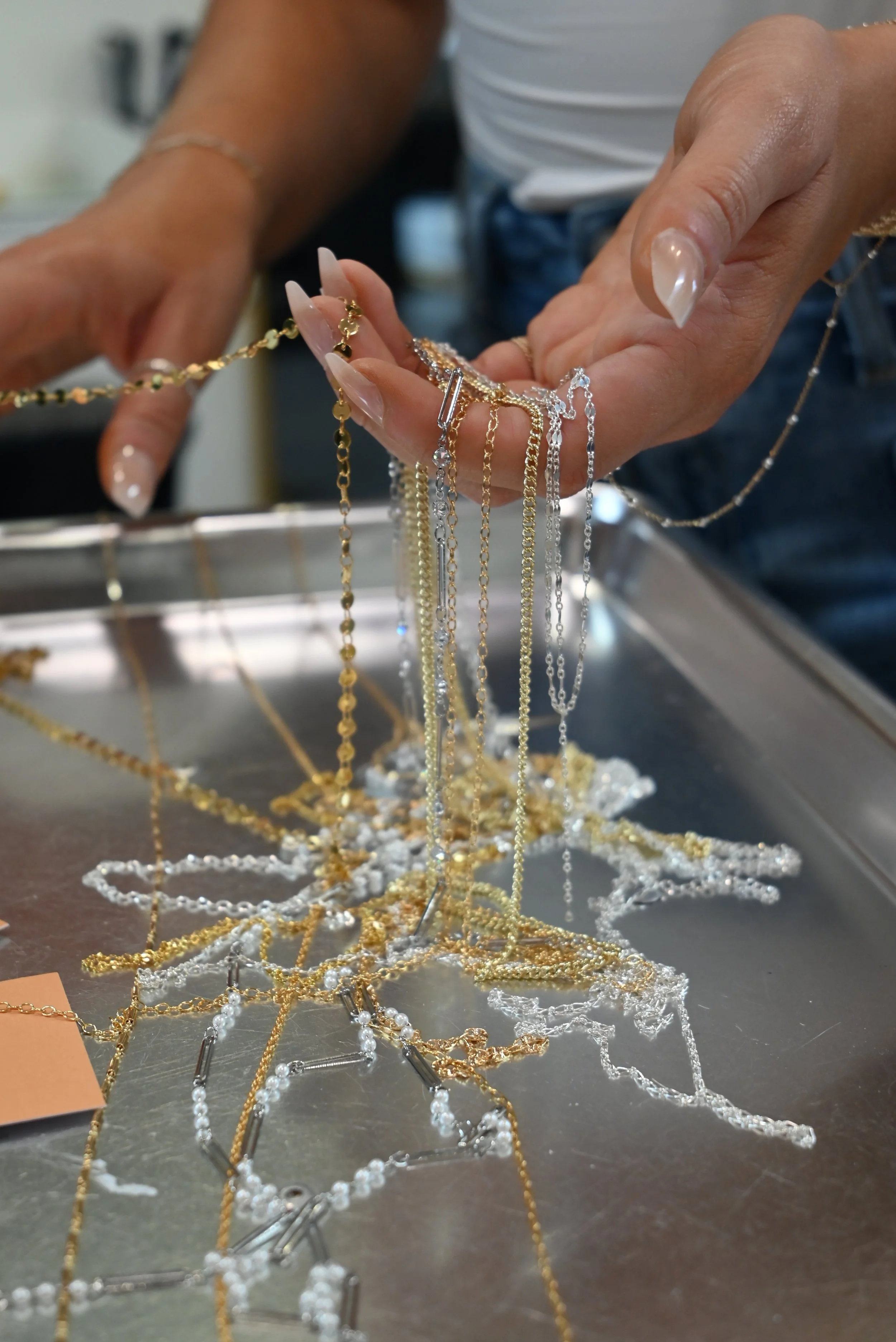 Permanent jewelry by Braze Permanent Jewelry in Broomall, PA, offering custom bracelets, anklets, necklaces, hand chains, charms, private parties and pop-up events.