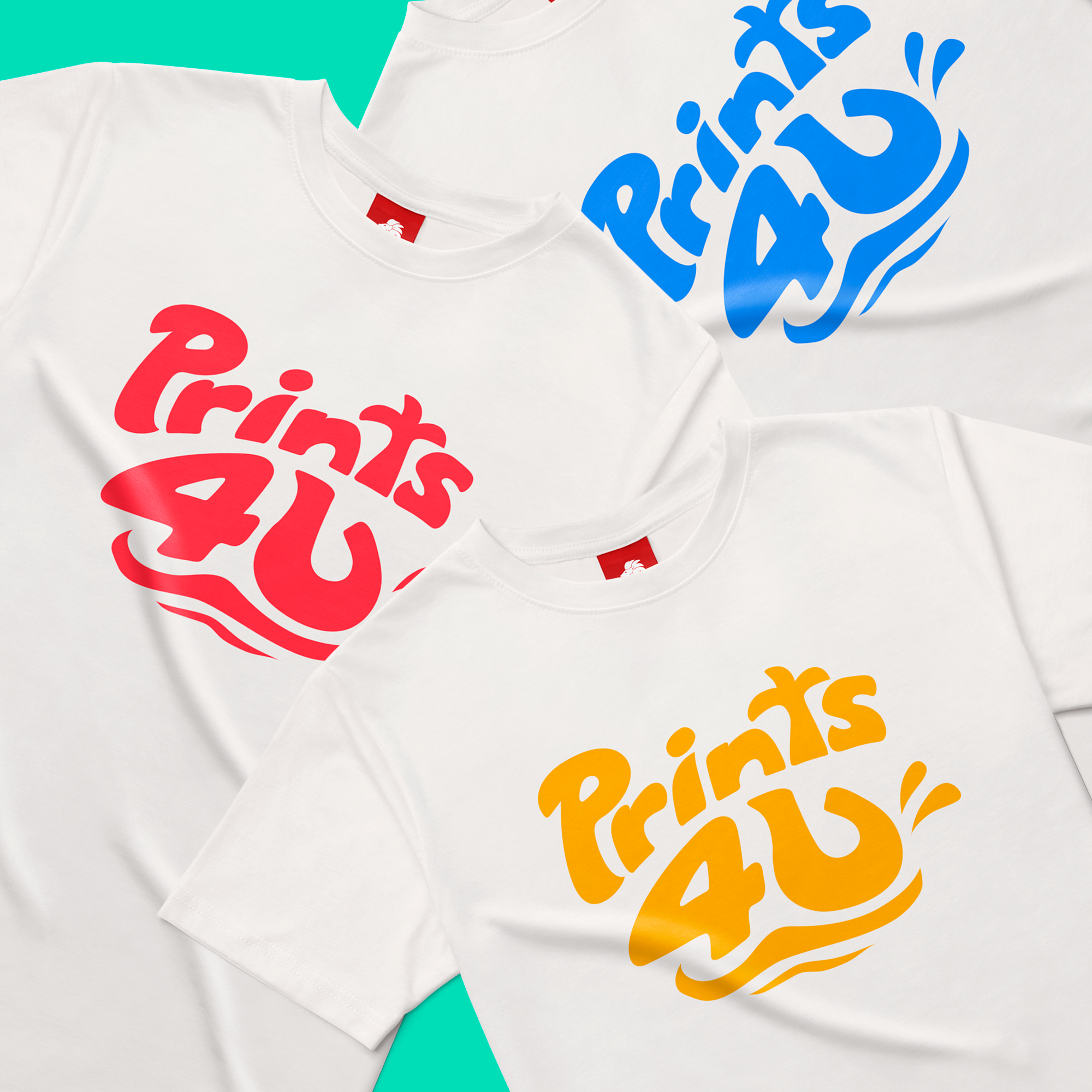 Close-up of white t-shirts laid on a flat surface with a colorful background. One t-shirt has red text, and the other has yellow text, both featuring playful, wavy font. The design includes blue and orange graphic elements accompanying the text, crea
