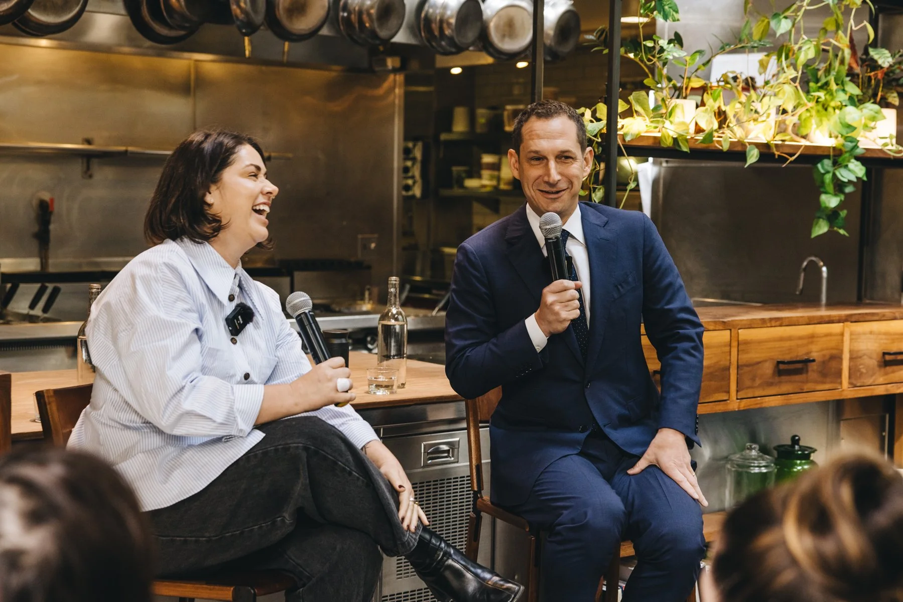 Mayor Daniel Lurie and Amanda Flores in front of a group of people at a BARC event
