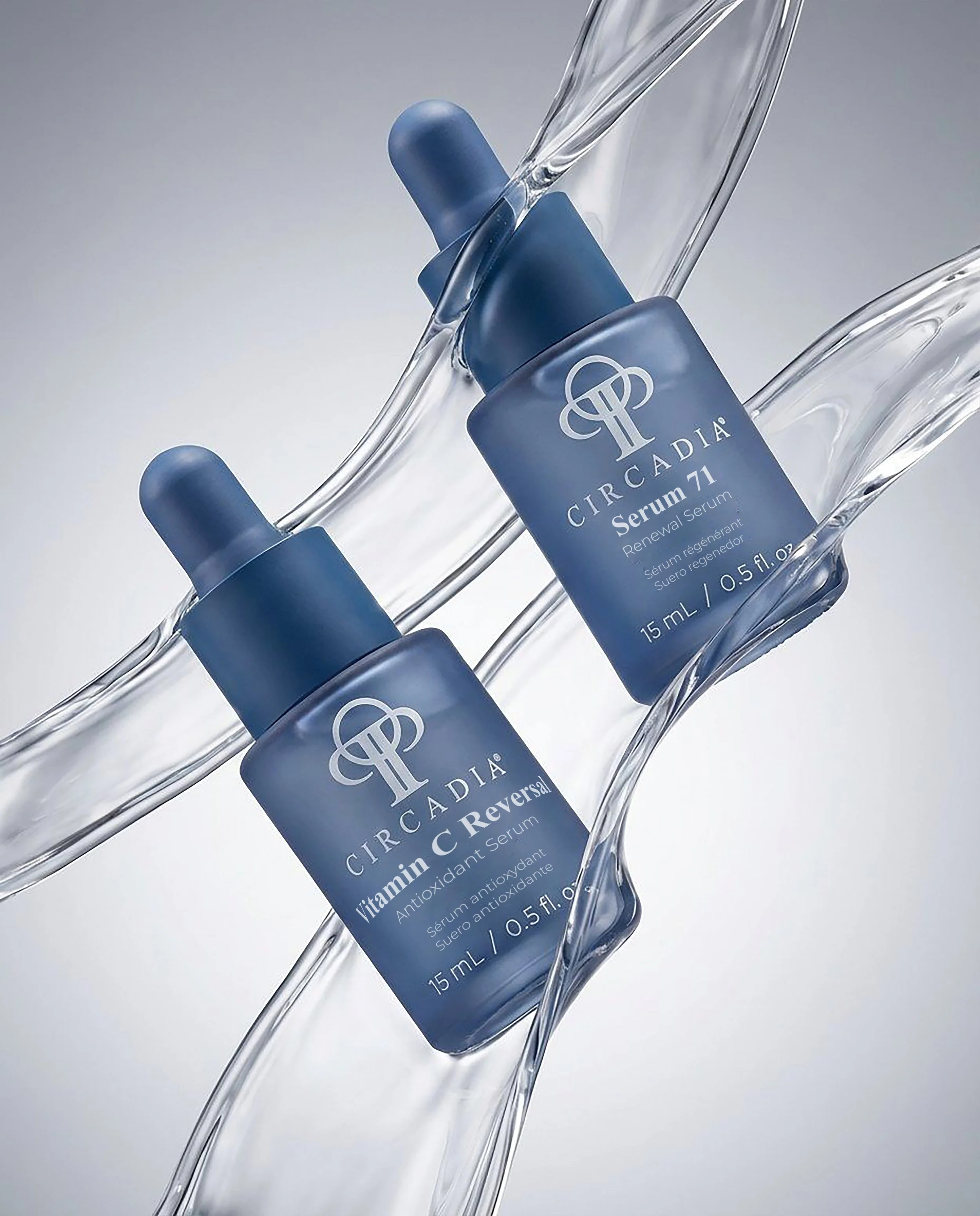 Close-up of Circadia Vitamin C Reversal Serum bottle partially submerged in water with a splash, featuring a dark blue label and a dropper cap.