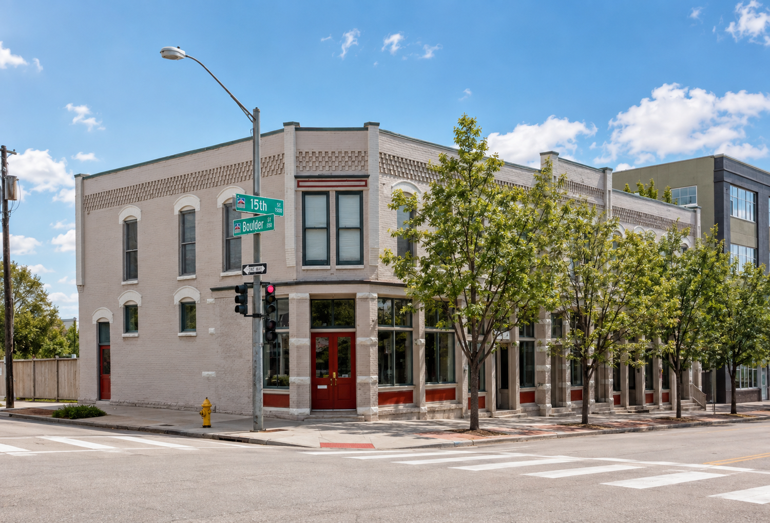 The historic corner building at 15th and Boulder that houses Strive Workspaces LoHi