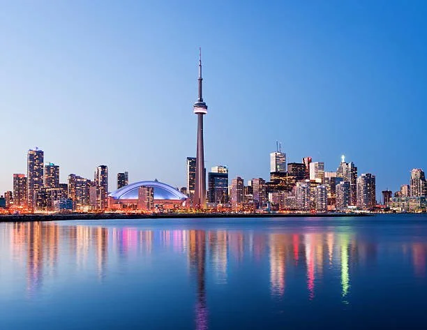 Toronto downtown skyline viewed across Lake Ontario with high-rise buildings along the waterfront