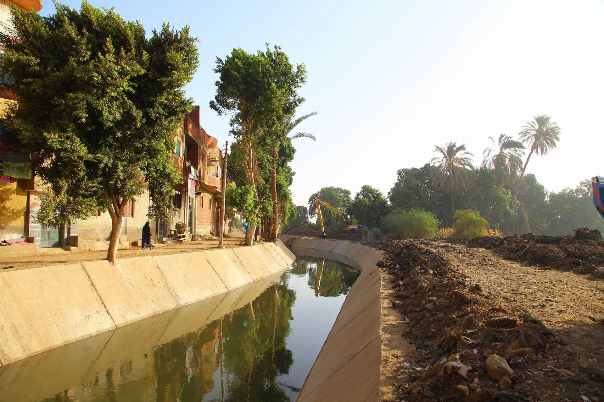 Large irrigation canal cutting through Egypt’s desert landscape as part of the country’s efforts to reclaim arid land for agriculture.