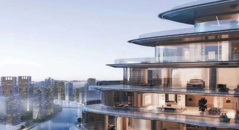 Mercedes-Benz Places architecture in Dubai featuring sweeping curved balconies and illuminated luxury residential spaces.