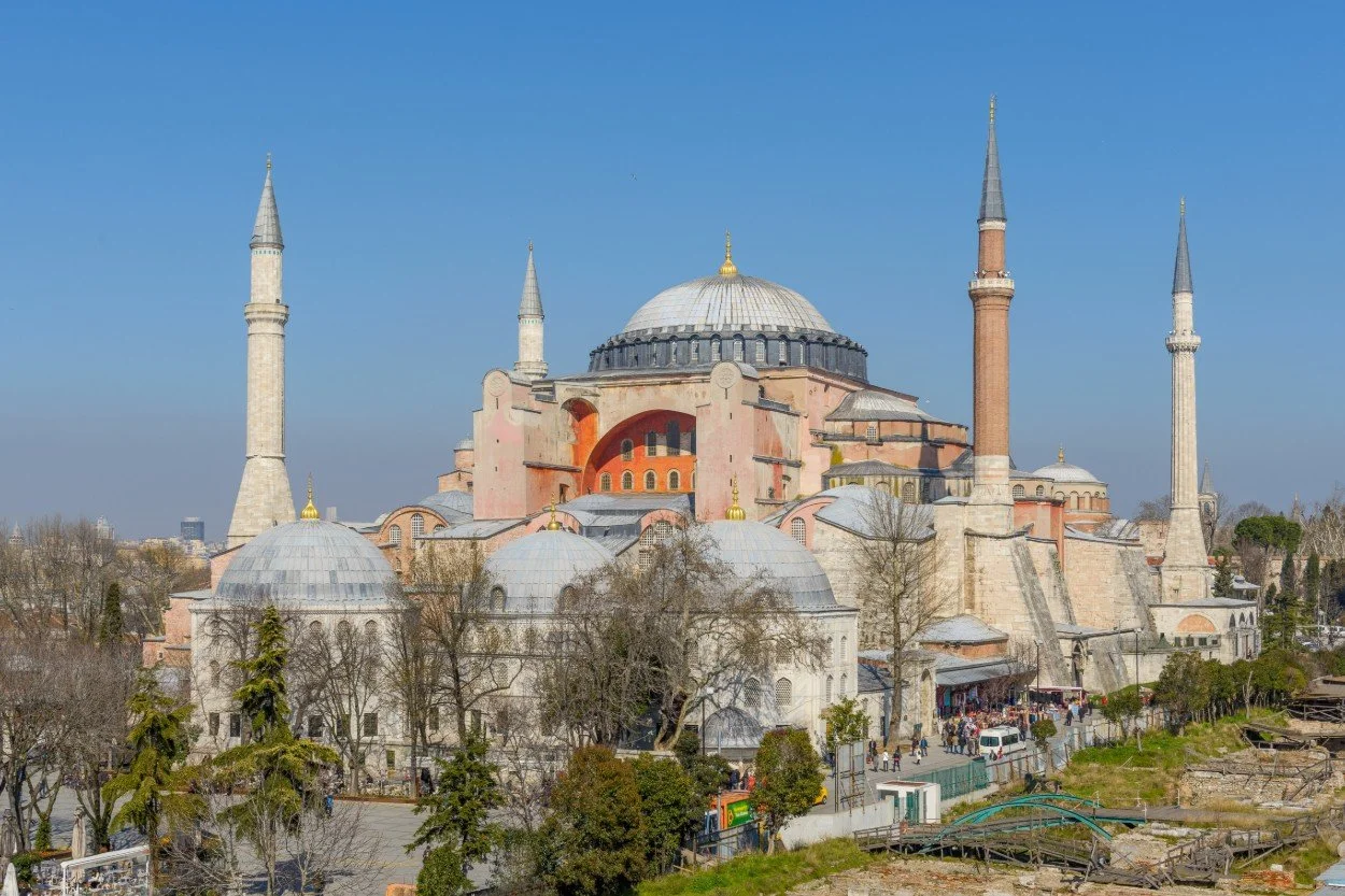 Hagia Sophia in Istanbul with its massive central dome and four minarets rising above the historic complex.