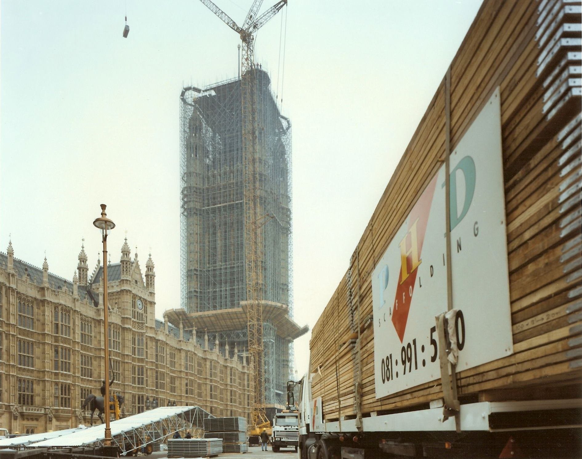 Victoria Tower at the Palace of Westminster rising beside extensive scaffolding during restoration work.
