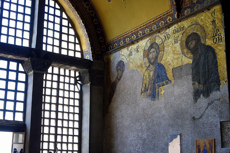 Thirteenth-century Deësis mosaic inside Hagia Sophia depicting Christ with the Virgin Mary and John the Baptist.