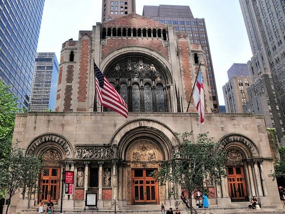 Historic St. Bartholomew's Church surrounded by modern Park Avenue buildings