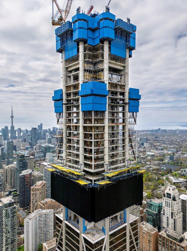 One Bloor West under construction with the CN Tower and Toronto skyline in the background