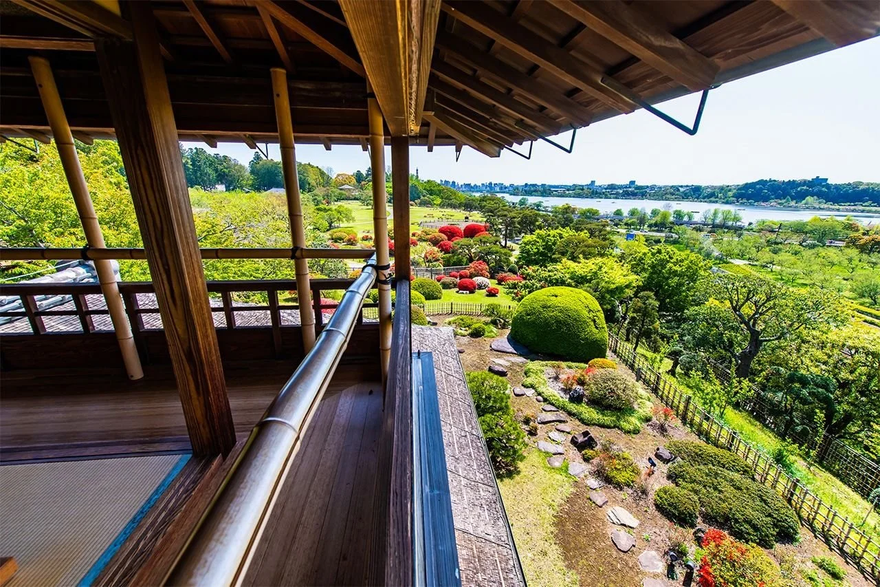 Japanese engawa with deep roof eaves opening toward a garden