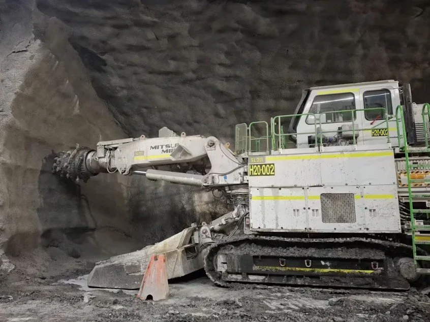 Heavy excavation machine cutting through rock during underground construction of Toronto’s Ontario Line.
