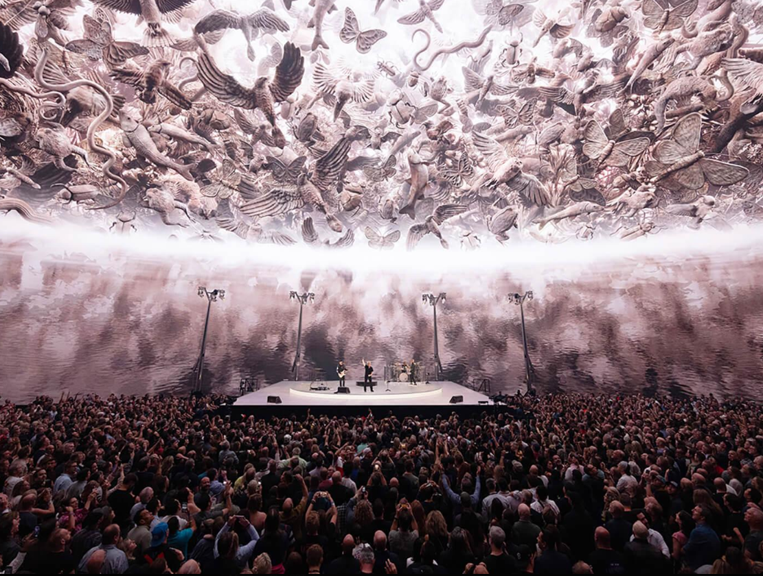 U2 performing inside the Las Vegas Sphere surrounded by the massive immersive LED screen