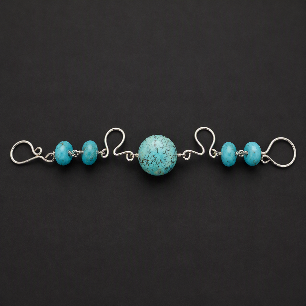 Turquoise surrounded by Sterling Silver