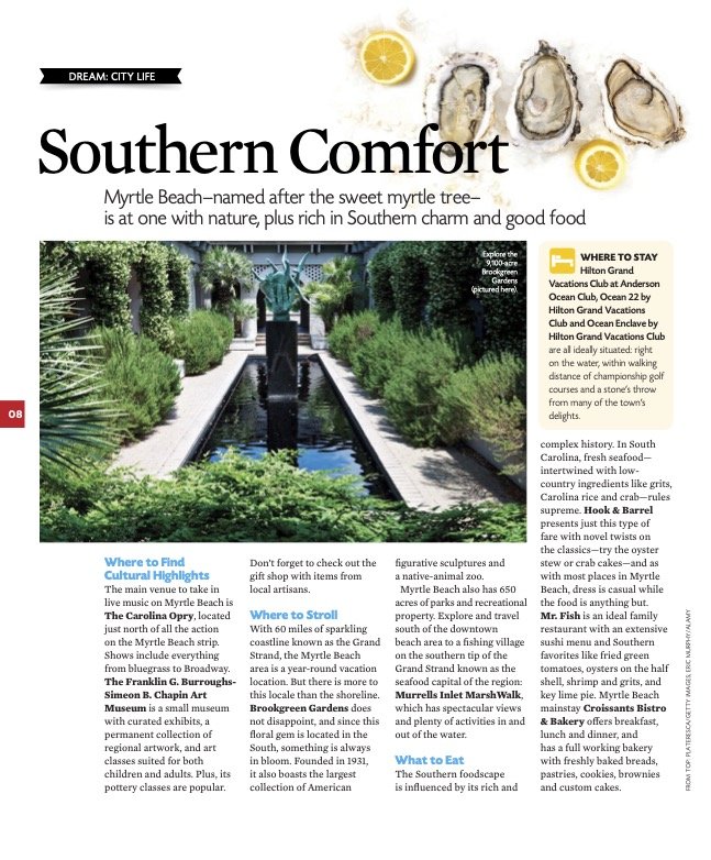 A travel brochure page promoting Myrtle Beach, South Carolina, featuring a lush garden pathway with a fountain, oysters, lemon slices, and text about local attractions, accommodations, and dining options.