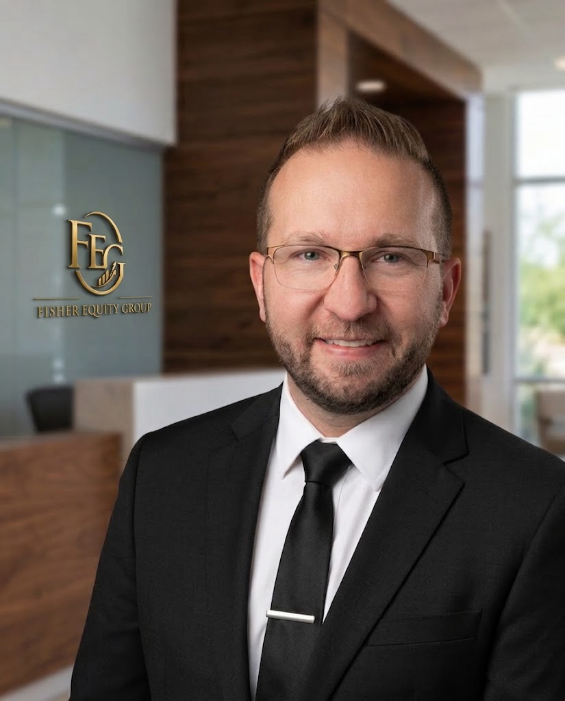 A man in a black suit and tie with glasses smiling in an office lobby with a 'Fisher Equity Group' logo on the wall behind him.