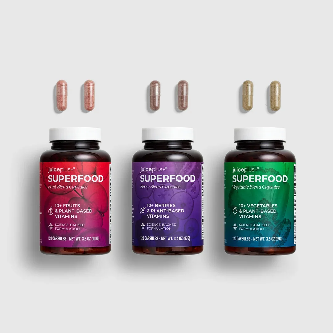 Juice Plus+ Superfood capsules with different flavors: fruit, berry, and vegetable.
