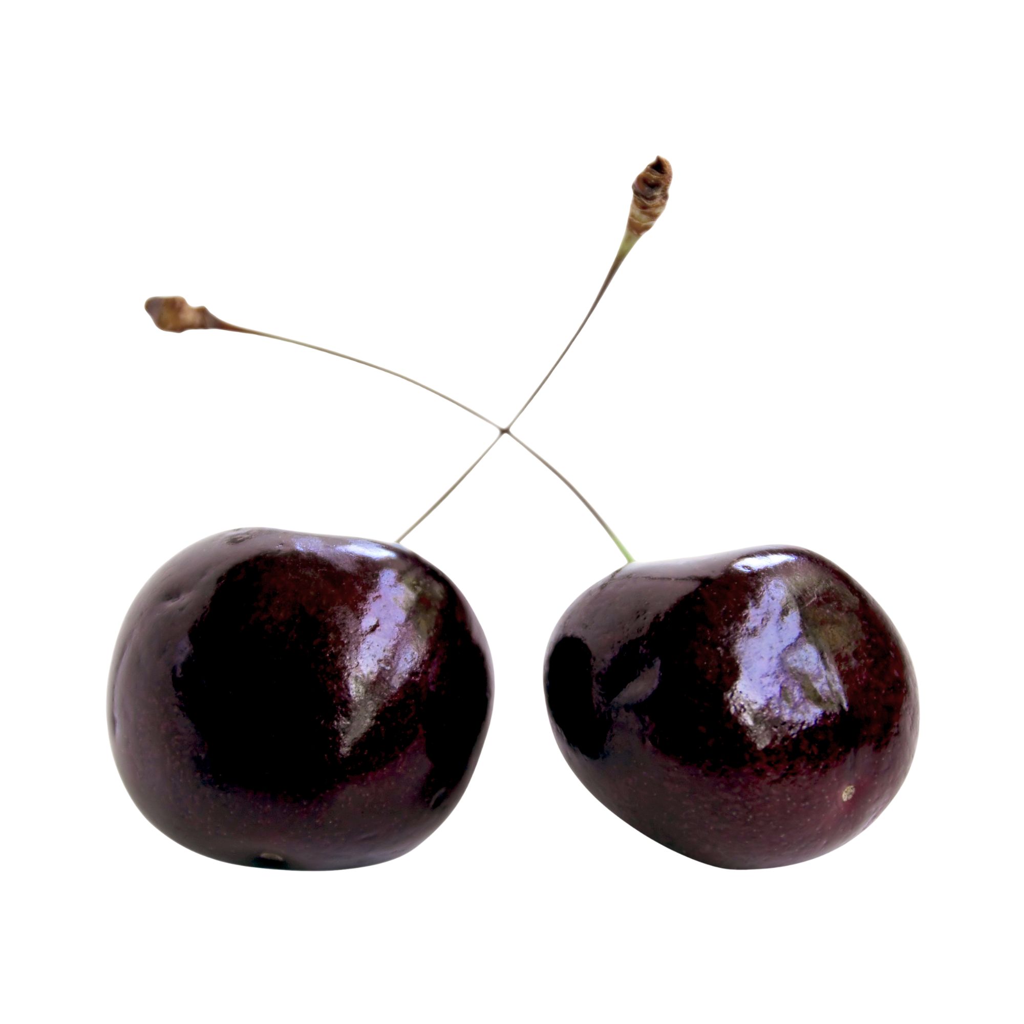 Close-up of 2 cherries on a black background.