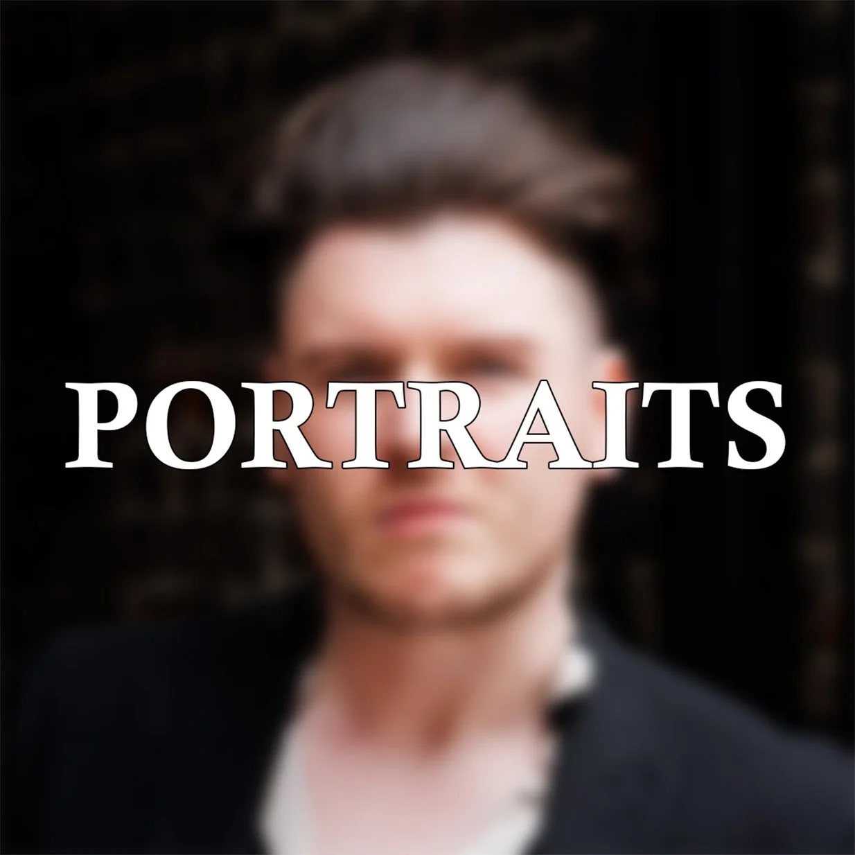 Blurred portrait of a woman with dark hair and glasses, overlaid with the word 'PORTRAITS' in large white letters.