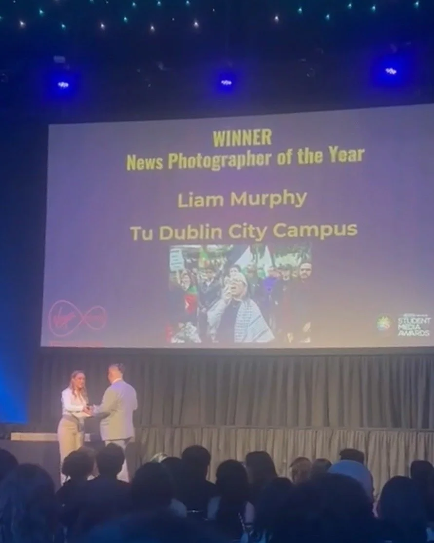 Liam Murphy accepts the News Photographer of the Year 2025 Award