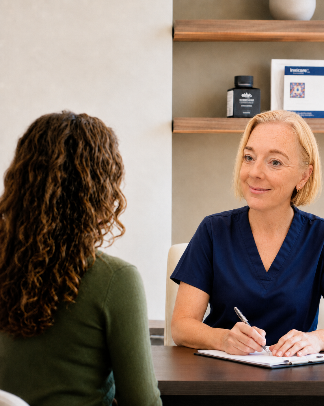 Lexington Wellness & Weight Loss nurse practitioner meeting with a patient in the clinic.