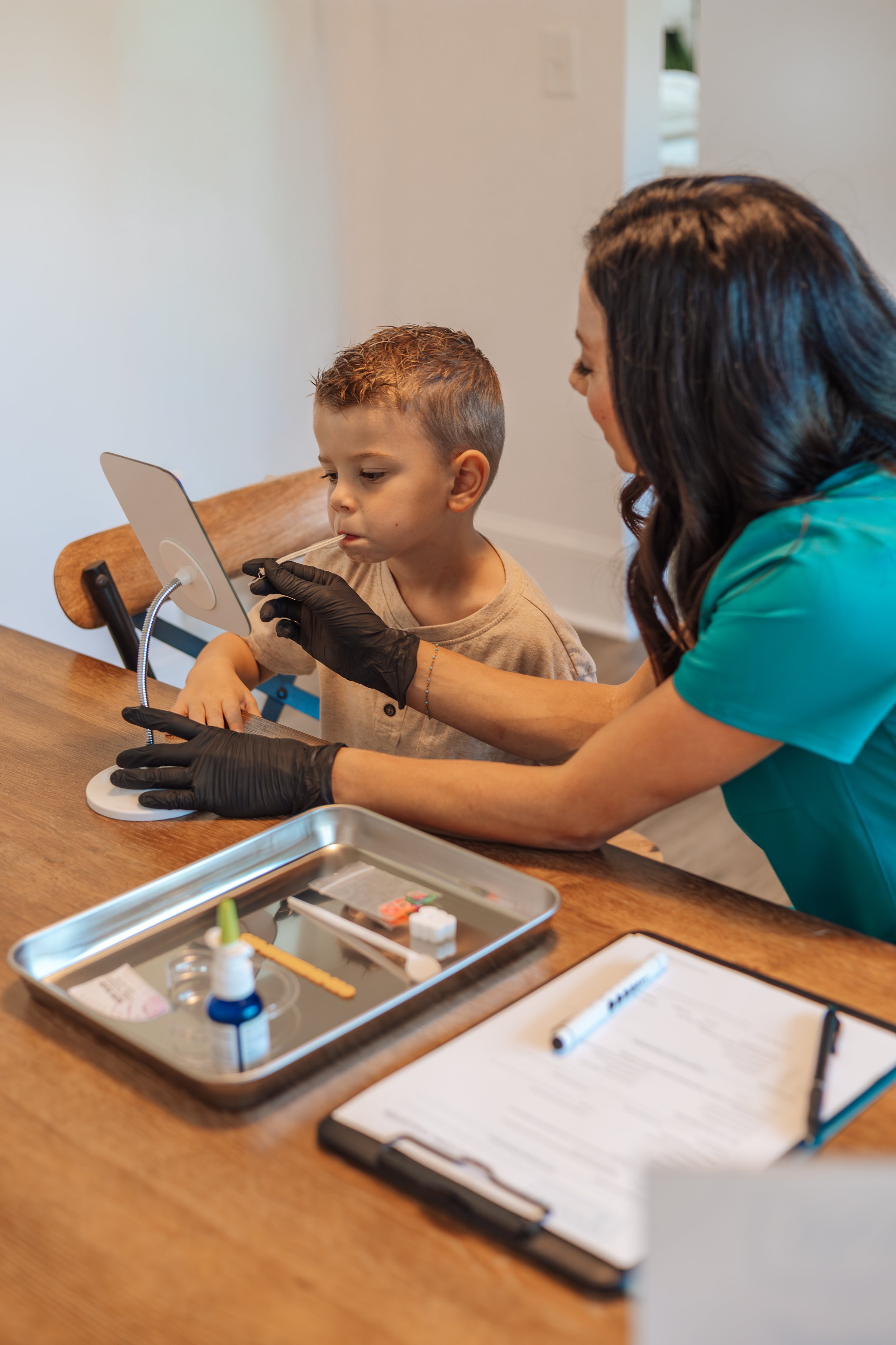 Aly VanDeRoer MyoLane myofunctional therapy exercise with child
