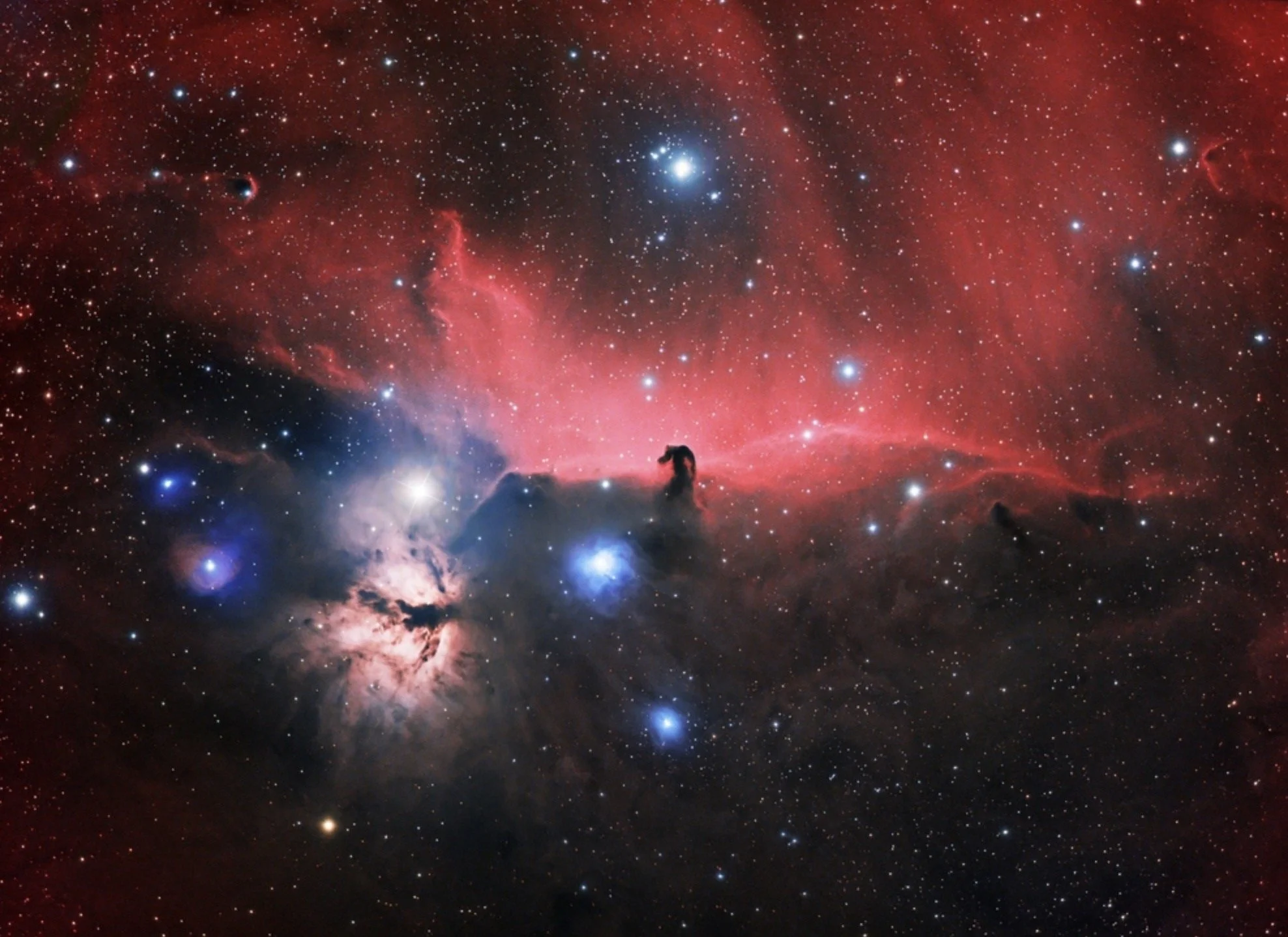 A colorful image of outer space featuring stars, nebulae, and cosmic dust with a silhouette of a horse or unicorn at the bottom.