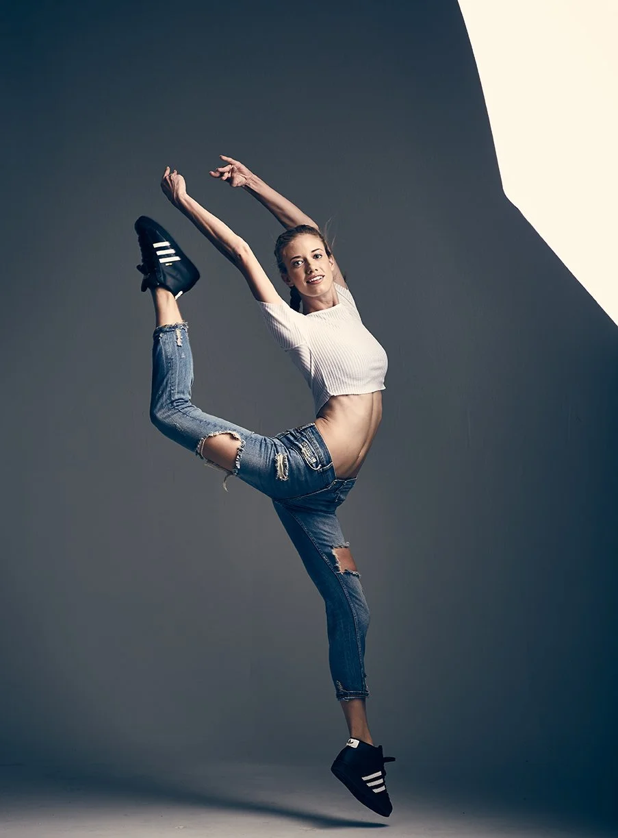 Dancer captured mid-jump in a studio, personal portrait by Michael Rudin