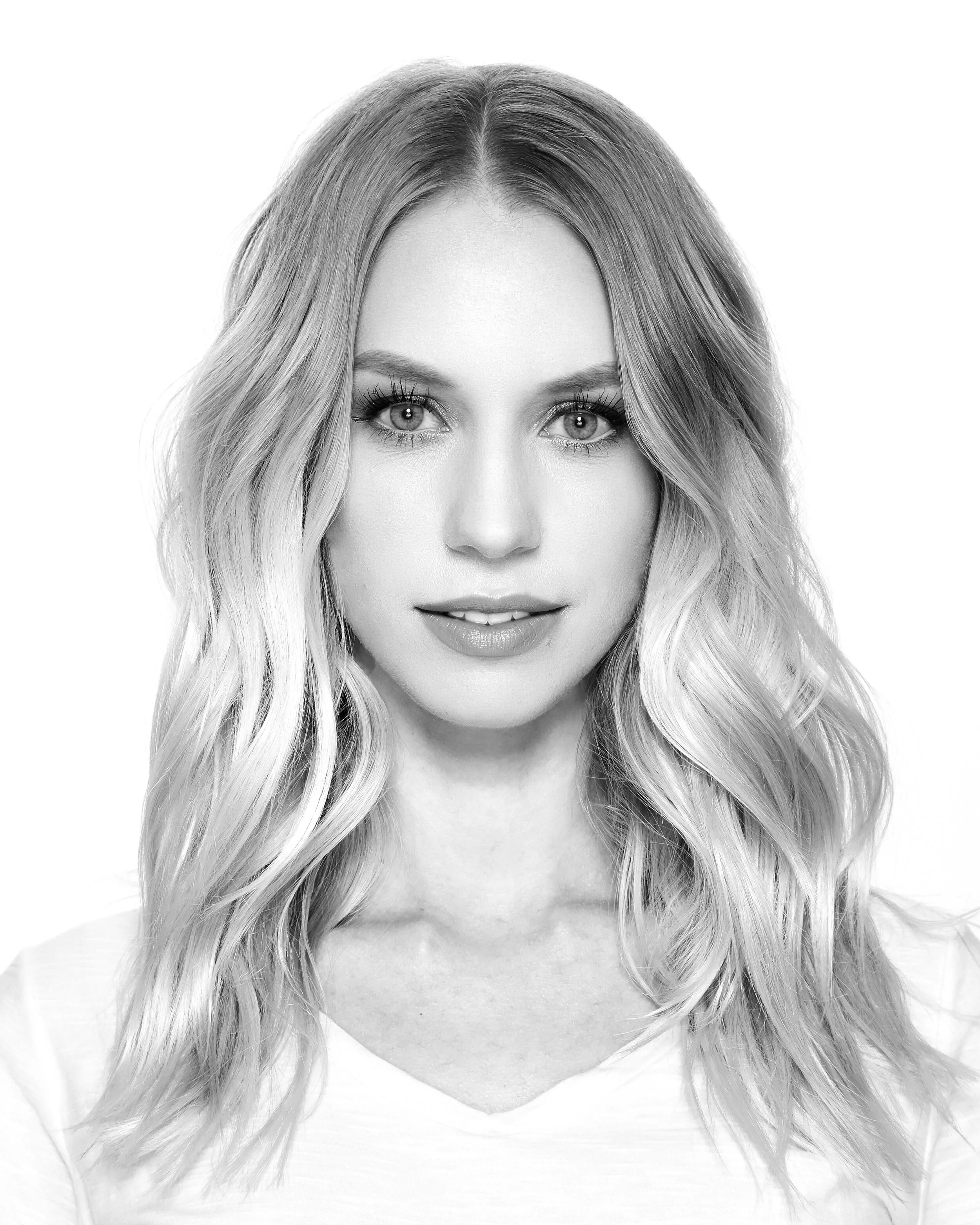 Black and white portrait of a woman with long wavy hair, personal work by Michael Rudin