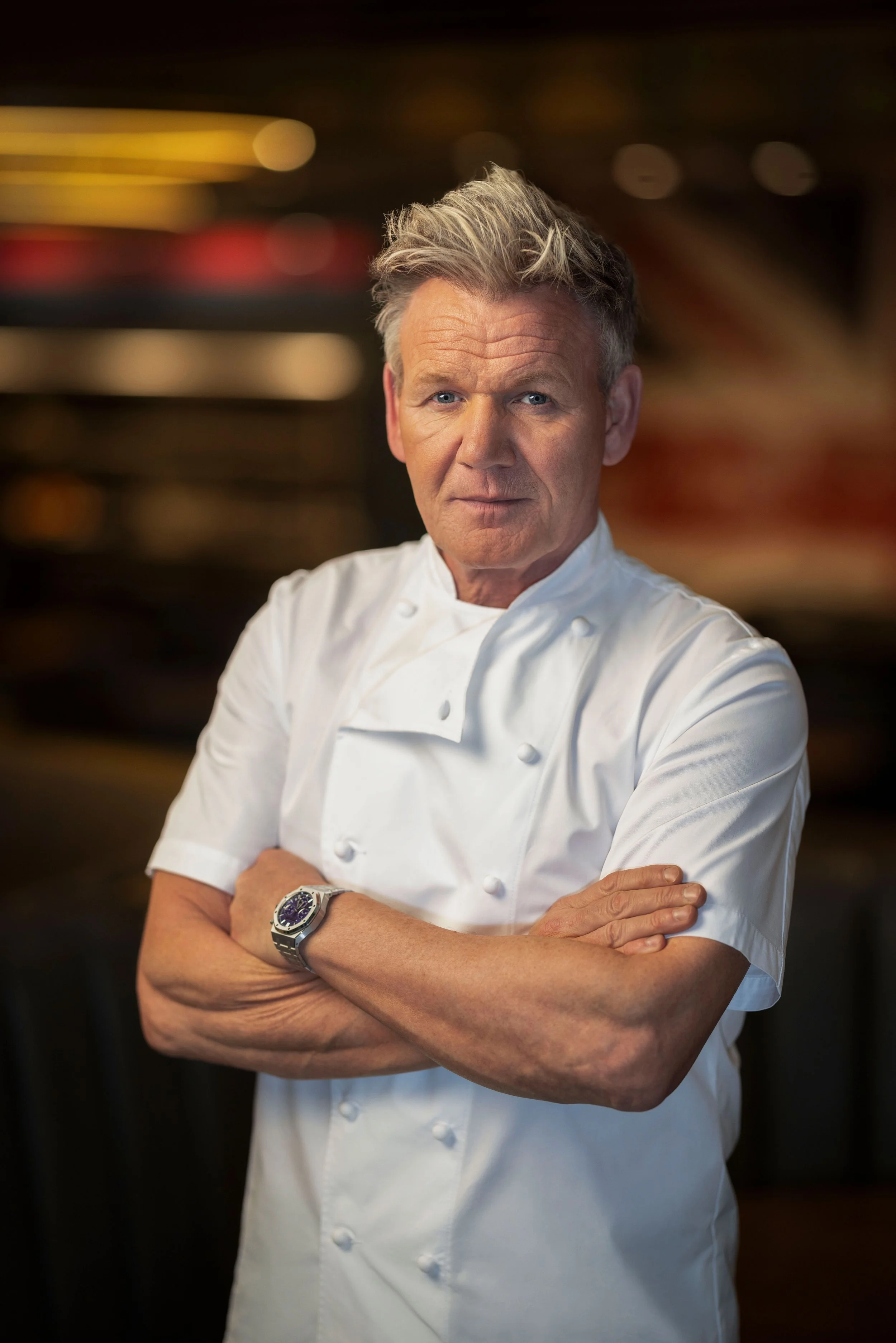 Chef Gordon Ramsay with arms crossed in a chef jacket at Gordon Ramsay Burger, Flamingo Las Vegas, photographed by Michael Rudin