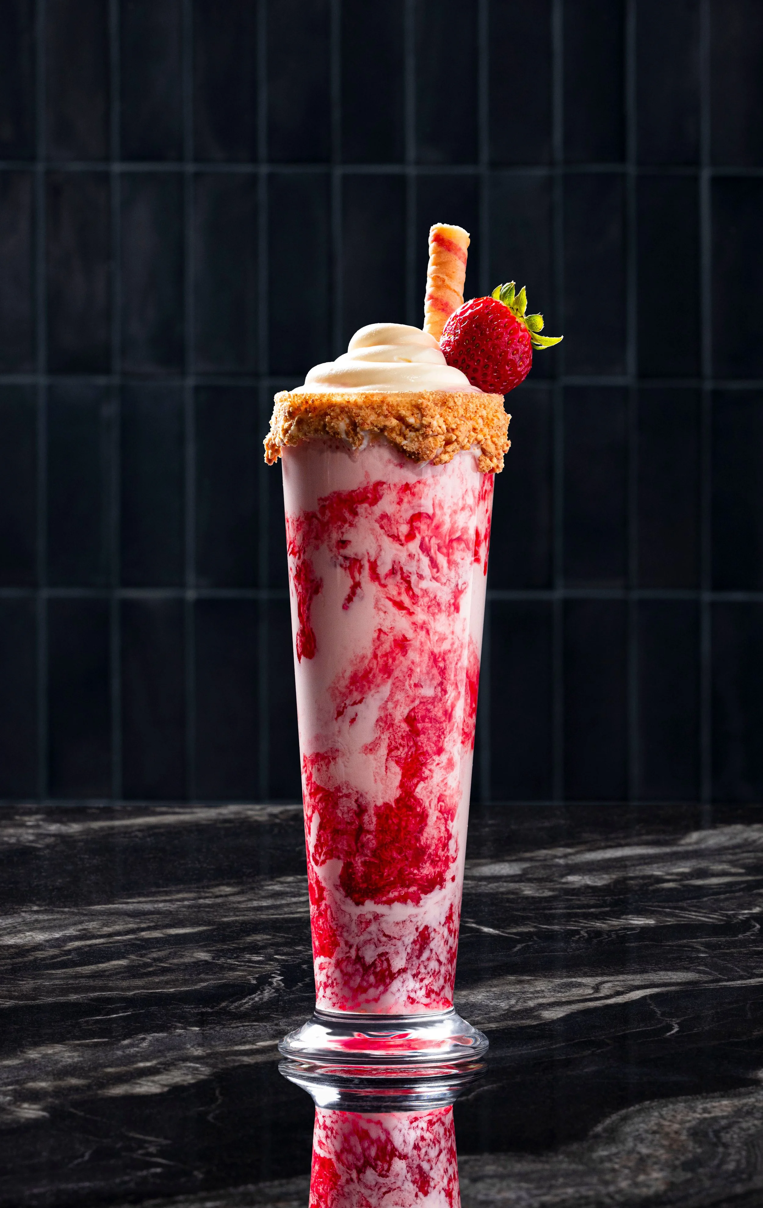 Strawberries and cream milkshake with whipped cream and a wafer garnish at Gordon Ramsay Burger, photographed by Michael Rudin