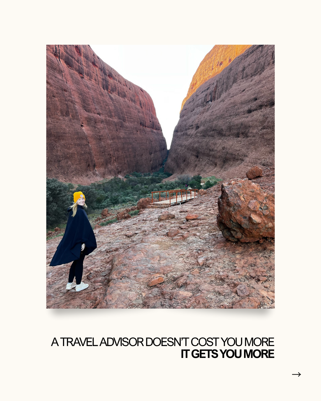 A woman standing in from of Kata Tjuta rock formation