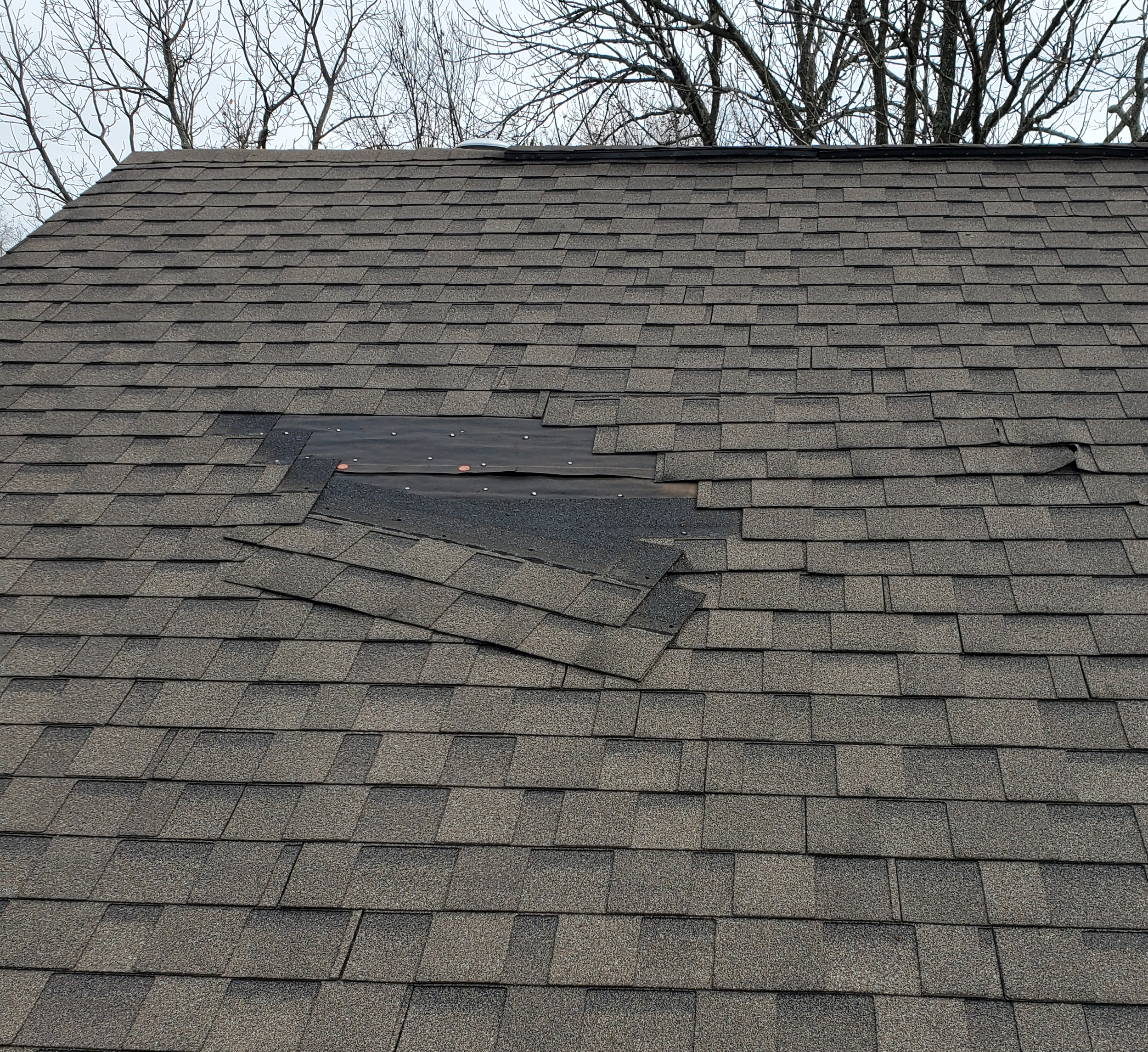 wind damage on a roof in louisville