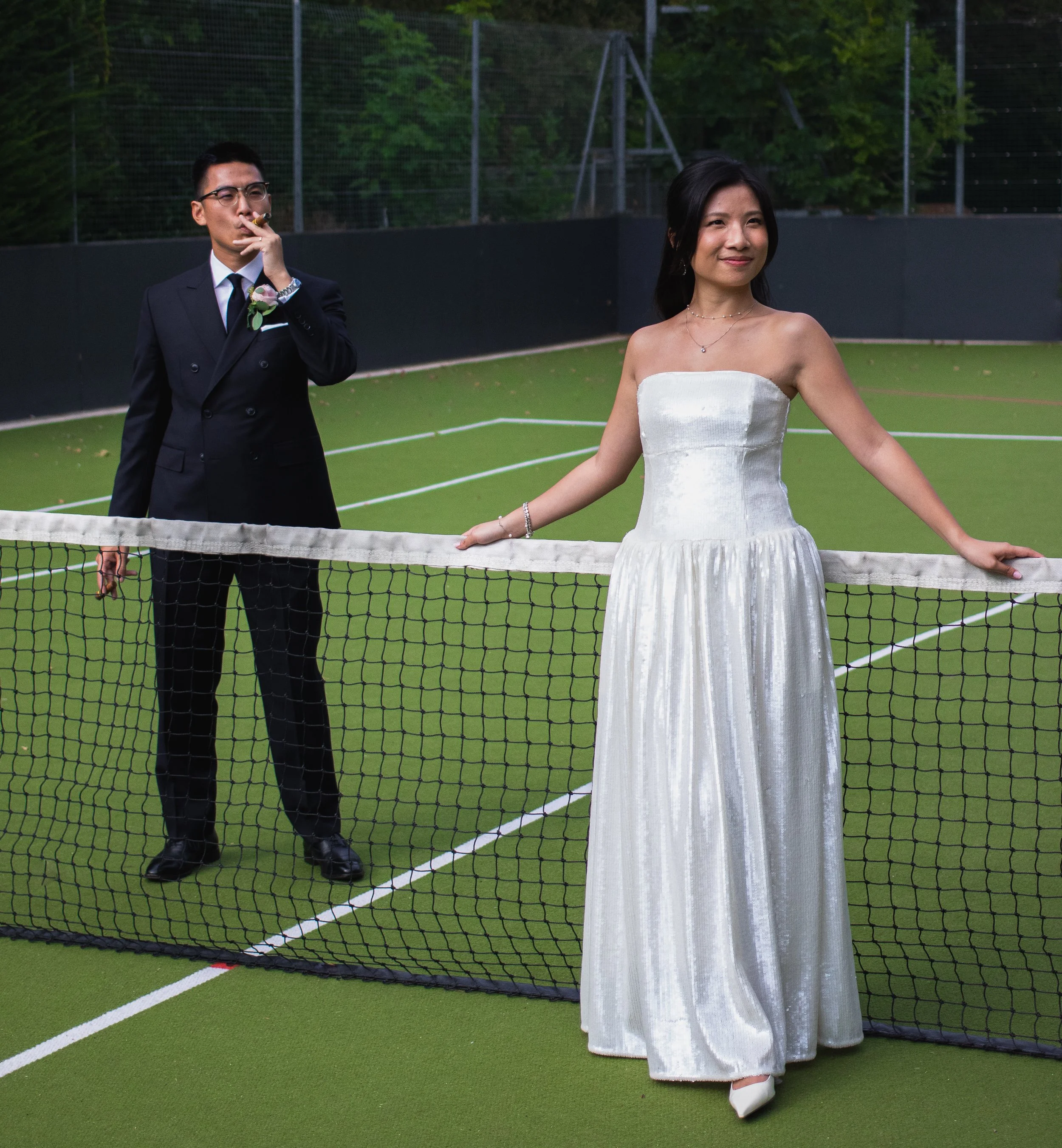 Groom and Bride editorial style portrait on a tennis court