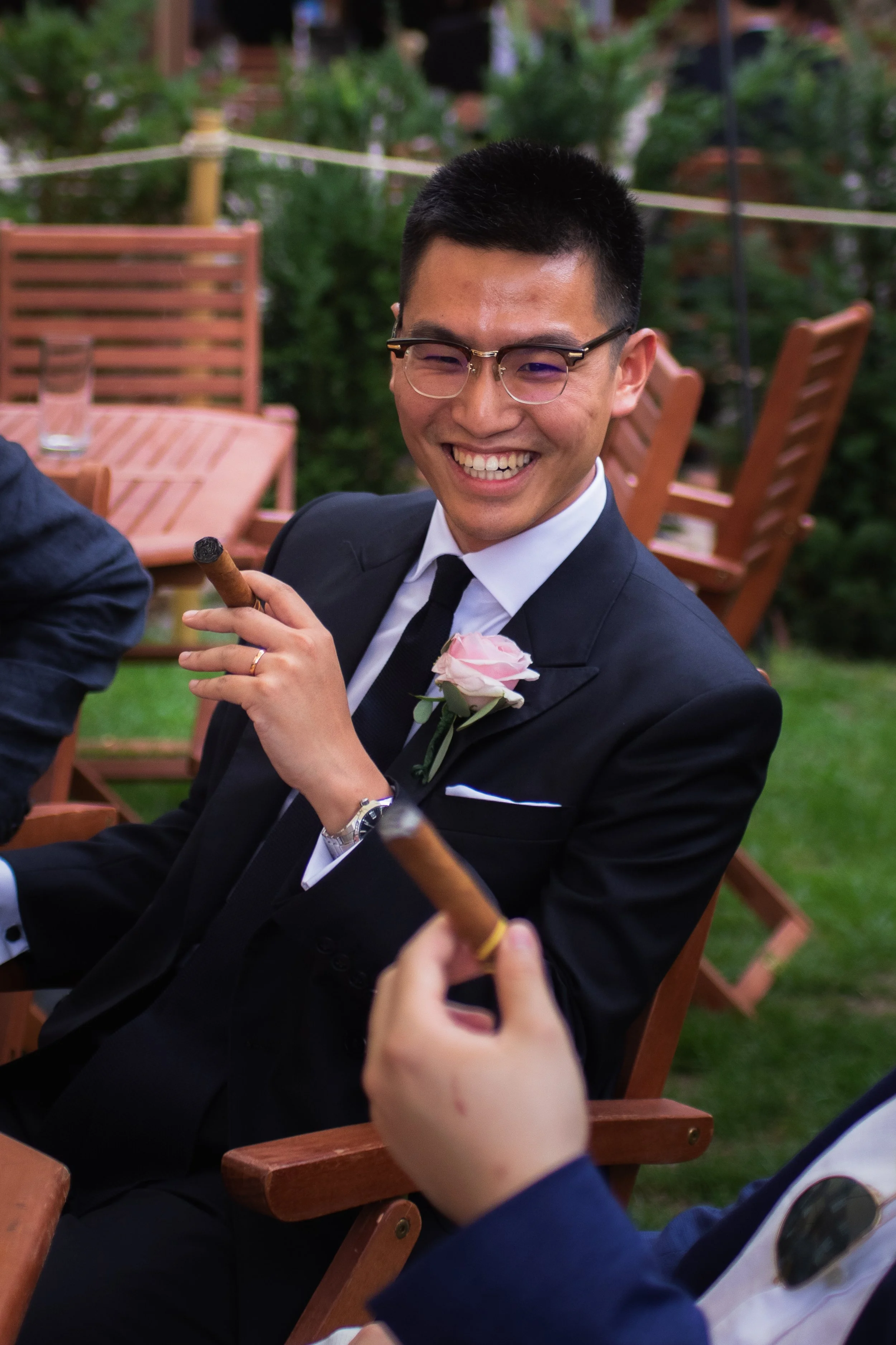 Groom at Regents Park smoking a cigar
