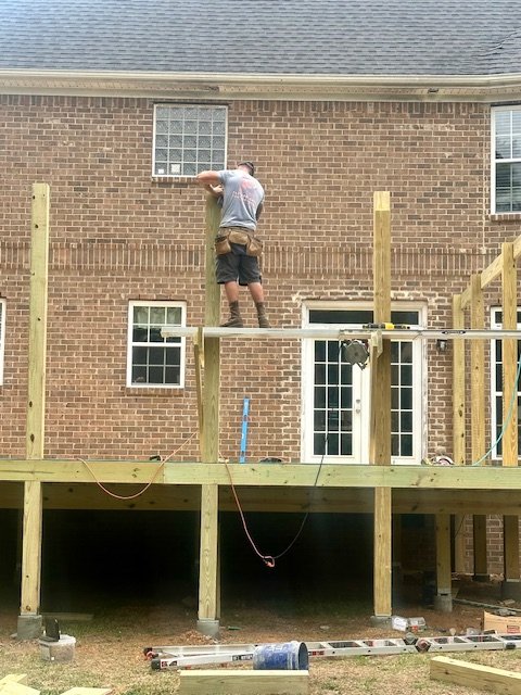 Custom composite deck construction by Prime Home Improvements.