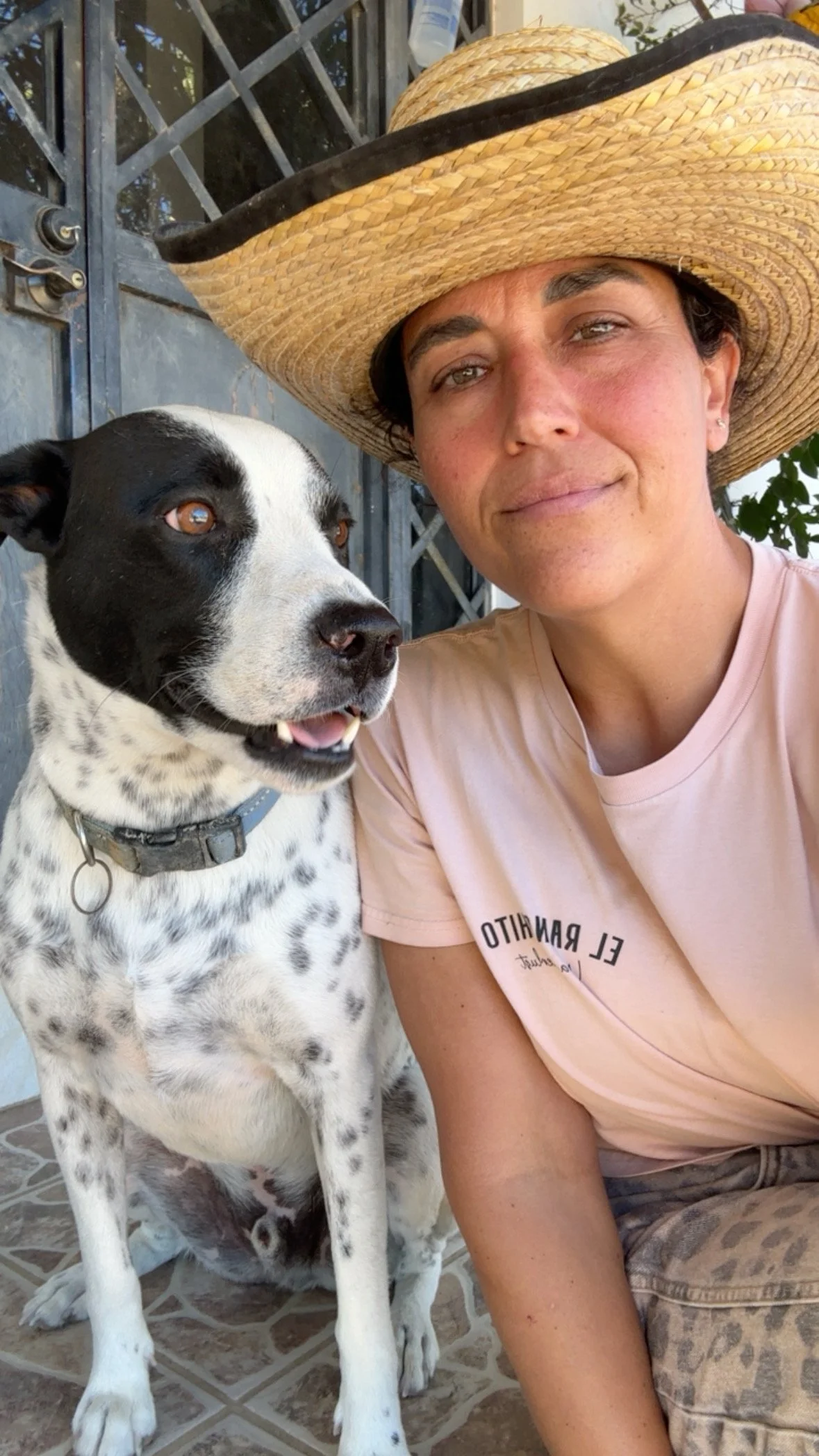 Woman with a dog at El Ranchito Wanderlust, a private dog daycare and boarding club in Todos Santos, Baja California Sur