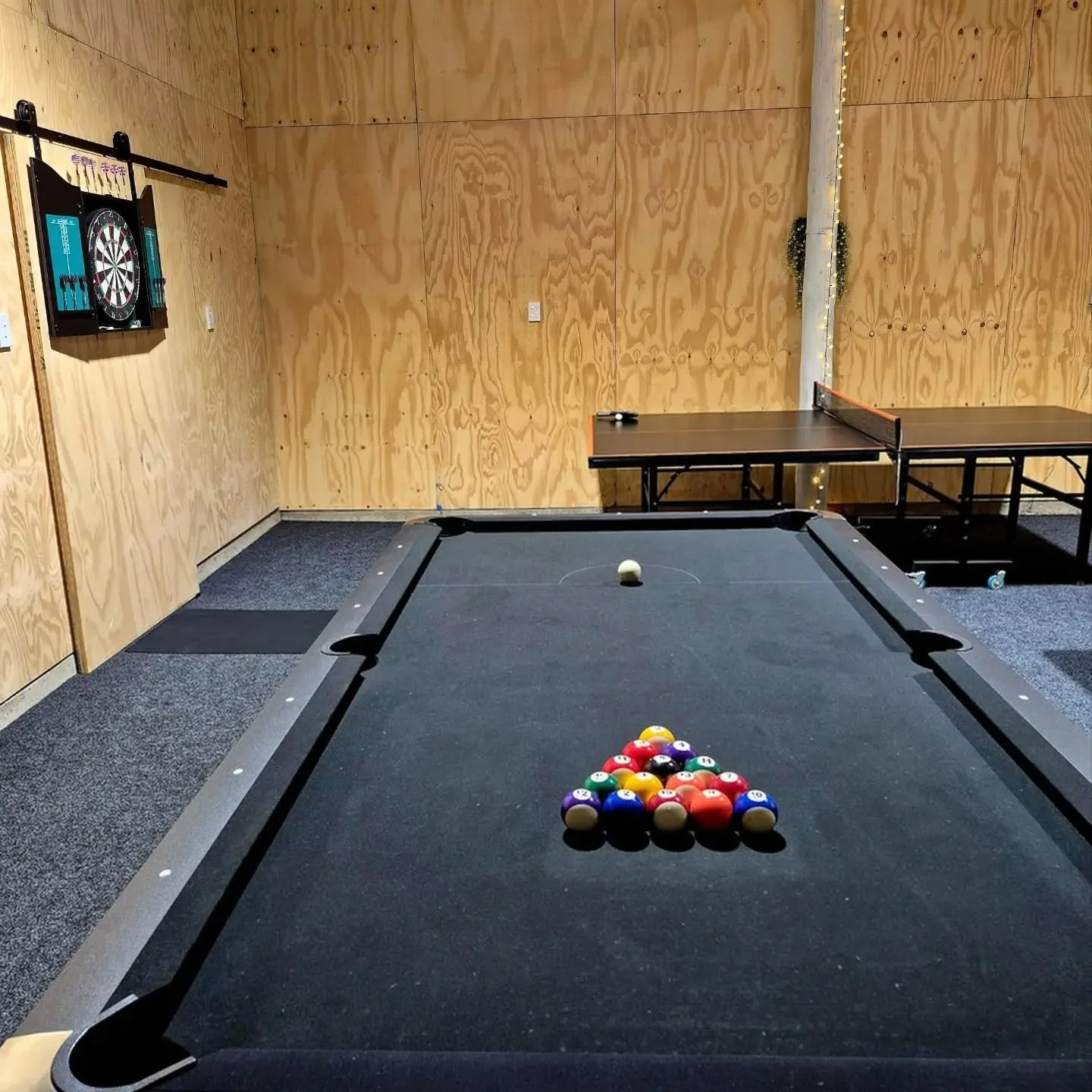 Rainy days? No problem.
🎱🎯🏓
When the weather turns, your own private games room becomes the perfect hangout &mdash; pool, darts, ping pong &amp; a cosy TV setup just for you!