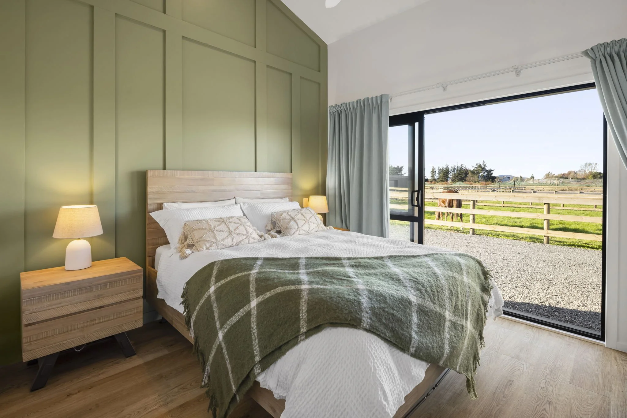 Queen bed with paddock views