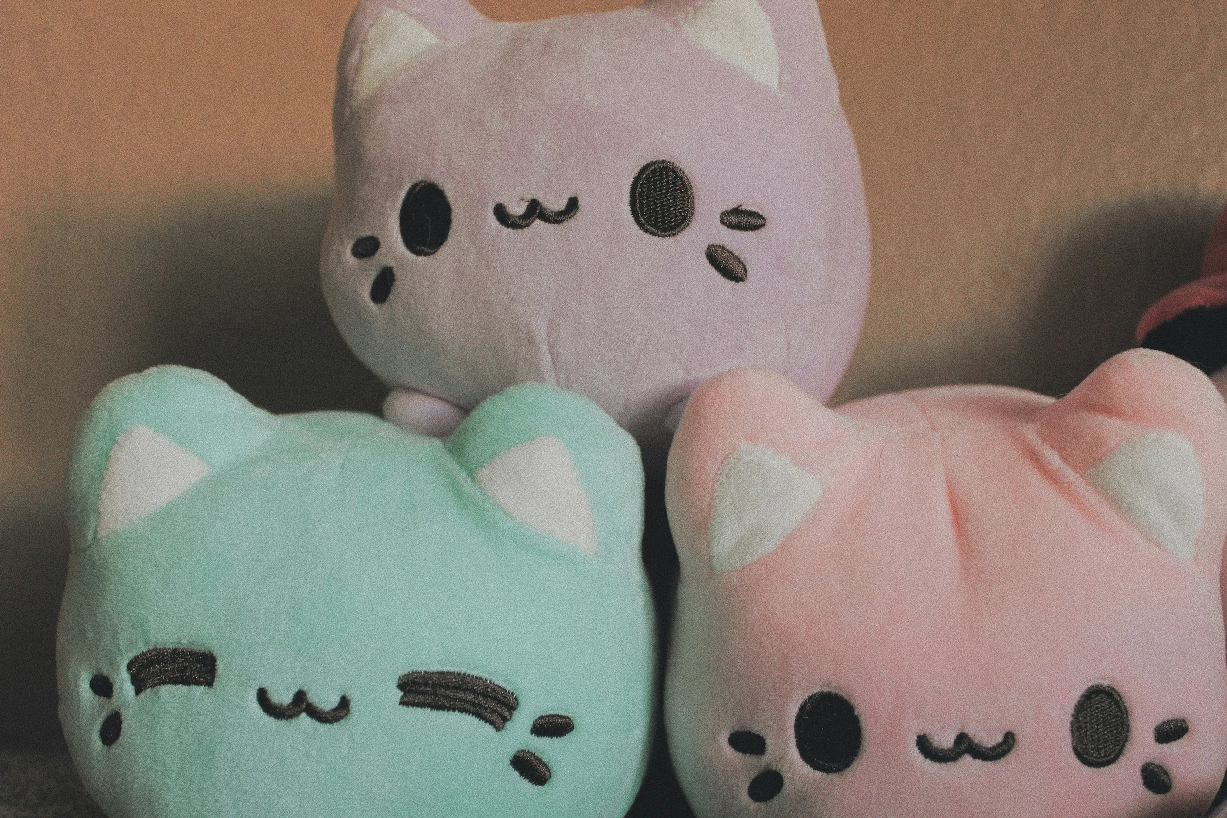 Pastel collectible plush toys grouped together