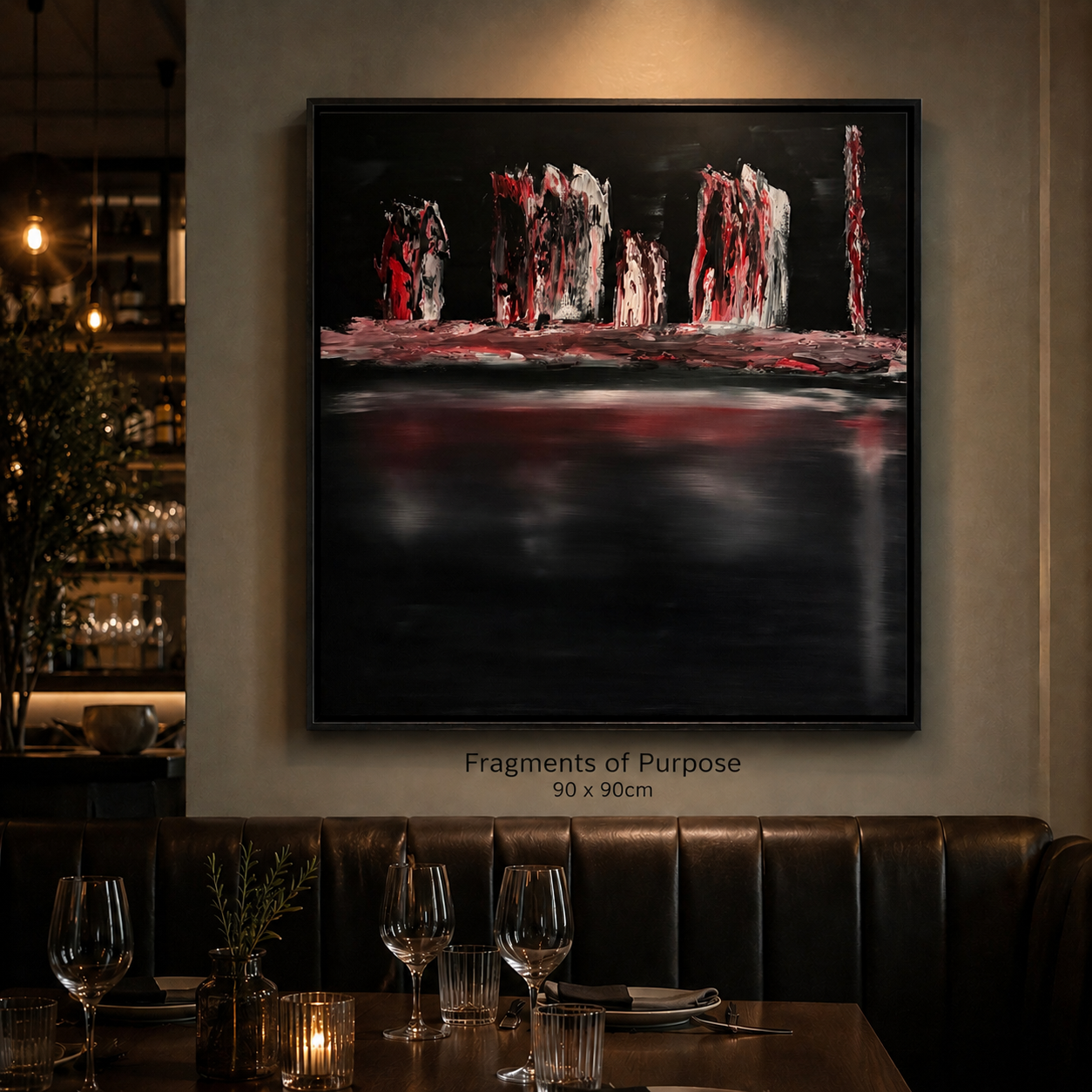 Abstract painting titled "Fragments of Purpose" on a wall in a dimly lit restaurant, with a table set with wine glasses, candles, and a small plant in the foreground.