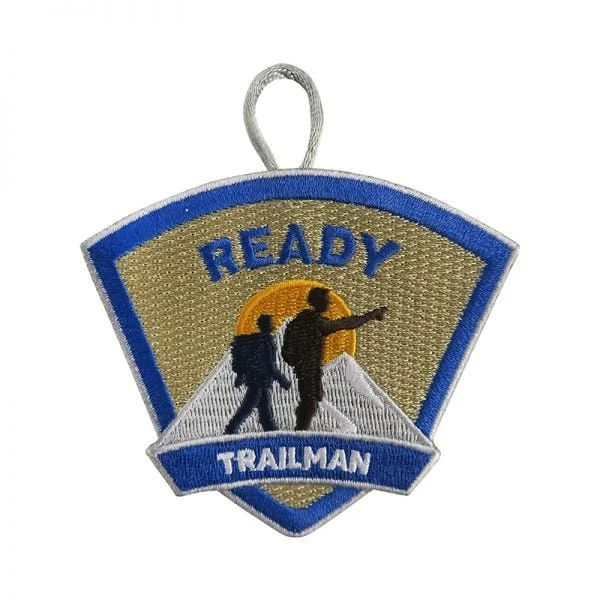 Embroidered patch with two hikers on a trail, a sunset in the background, and the words 'READY TRAILMAN'