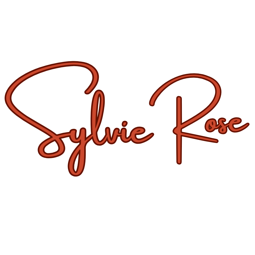 Neon sign reading 'Sylvie Rose' in cursive red font on a black background.