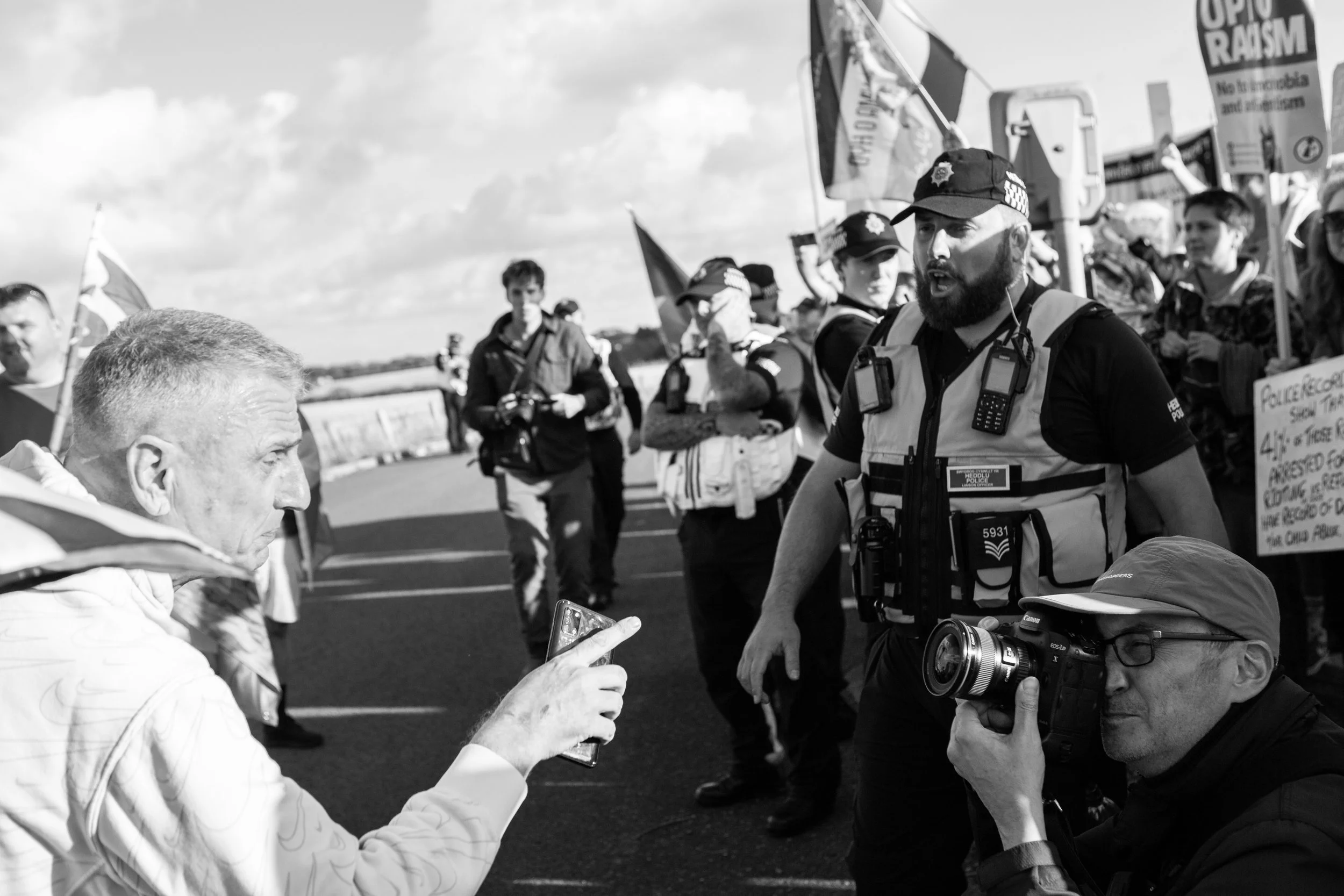 Far-Right activist is confronting a journalist taking his picture / Holiday Inn, Barry, 2025 