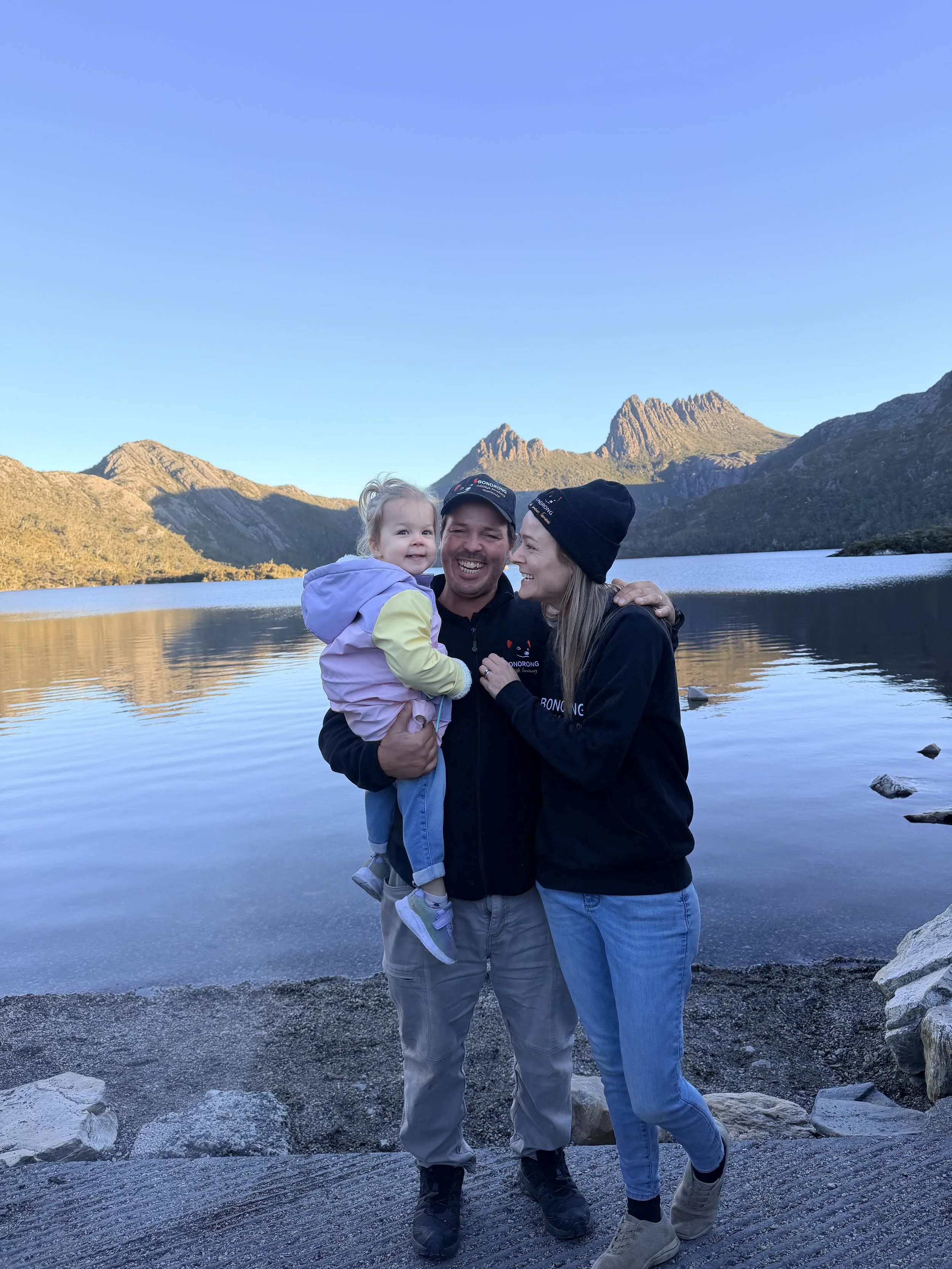 Greg Irons, Melissa Irons and their daughter Lara Irons together at Cradle Mountain on the edge of Dove Lake
